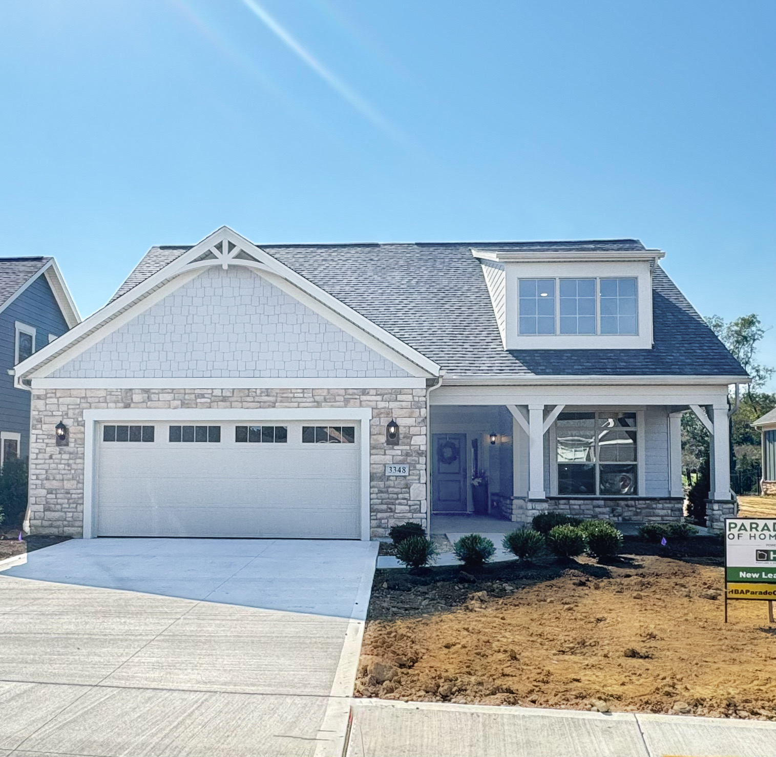 3348 Willow Lane is a move in ready Torino model home by New Leaf Homes featuring a spacious garage and driveway.
