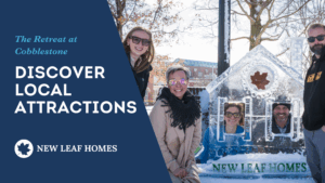 New Leaf Homes team poses at Medina Ice Festival behind an ice sculpture shaped like a house with the company logo.